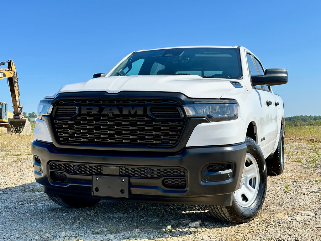 front view of a white work truck on a construction site background