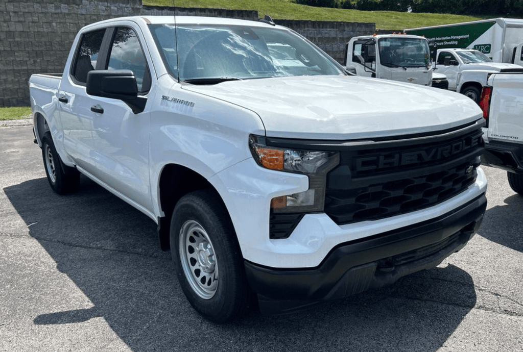 white work truck in a parking lot
