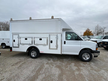 side view of a white van in a parking lot