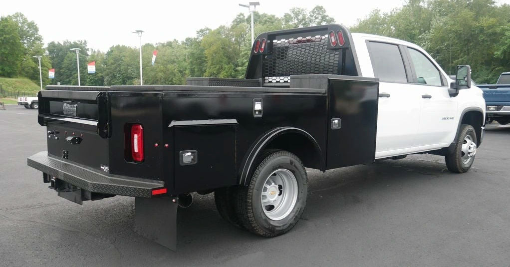 back view of a white work truck on a parking lot